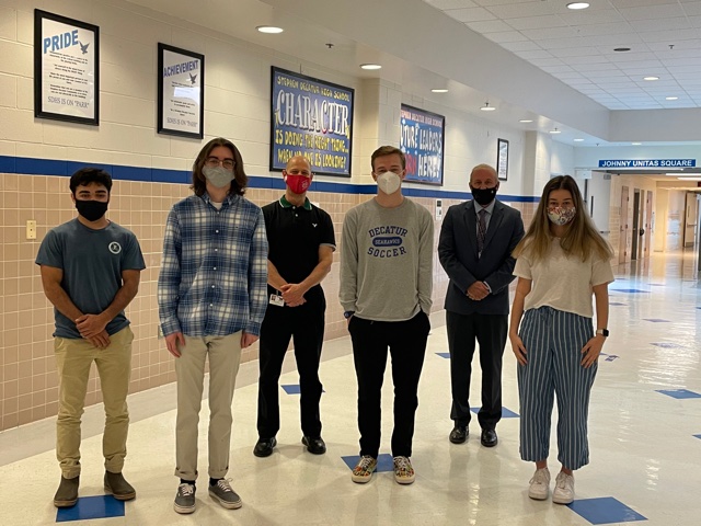 Pictured from left to right: Ian Ramnarain, Owen McAdams, Business Chairman Kurt Marx, Zach Powers, Principal Thomas Sites, and Elizabeth Pivec.